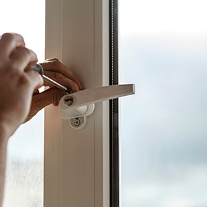 Window handle Installing by screwdriver. Making a house cozy and warm. Security  window handle Lockable Protection Safety